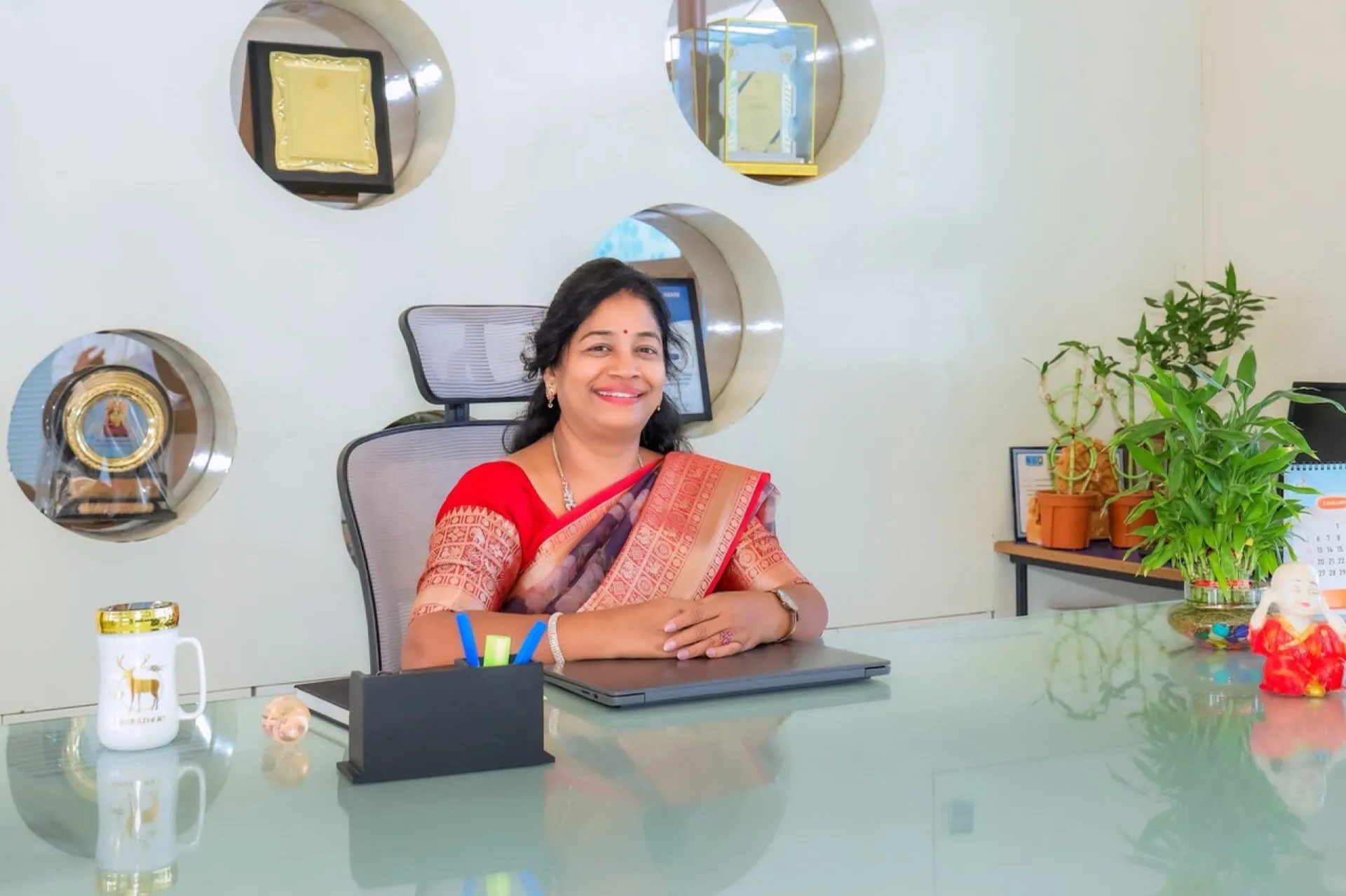 Mrs. Umadevi Srinivas Dhyavarshetty, Secretary, at their desk